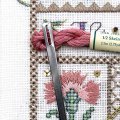 A sturdy flat needle for guiding threads into place