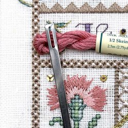 A sturdy flat needle for guiding threads into place