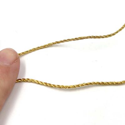 This small trim can be couched in decorative patterns