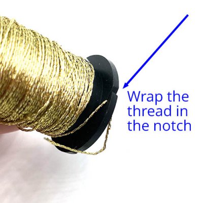 Secure the thread in the notch