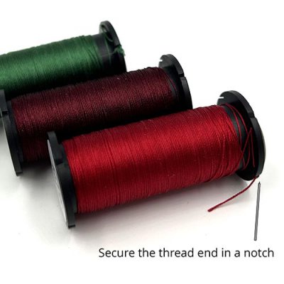Secure the thread end in the notch