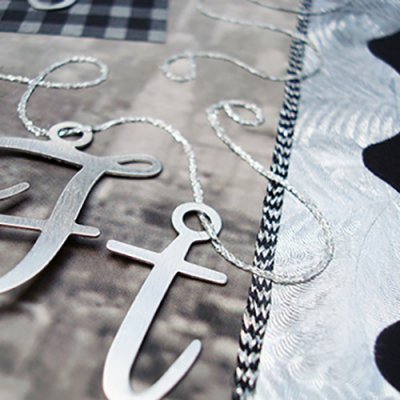 Iron-on Braid is an easy way to attach charms to paper crafts