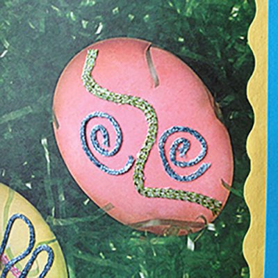 Decorate scrapbooking papers with iron-on thread