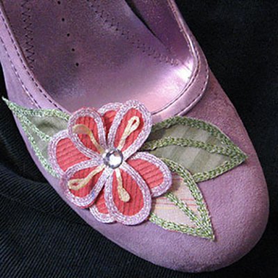 Use iron-on ribbon to edge appliques