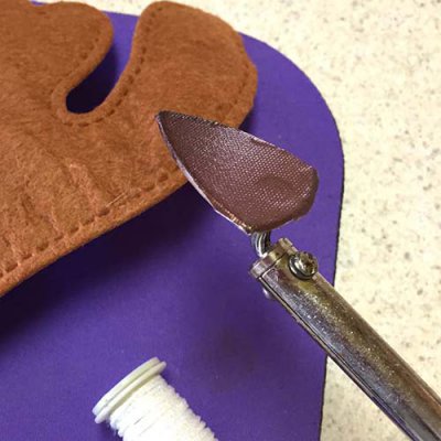 We recommend the Clover Mini Iron and our Adhesive Press Cloth