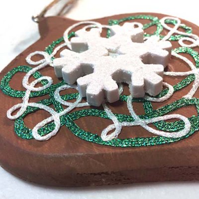 Use Kreinik Iron-on Braid (white) over Iron-on Ribbon (green)