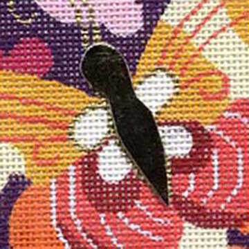 Gold leather makes a fun applique on needlepoint