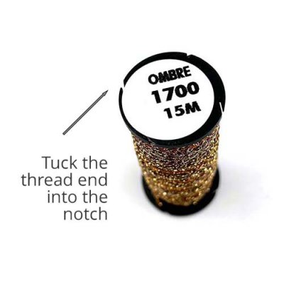 Secure the thread end in the notch