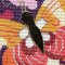 Gold leather makes a fun applique on needlepoint
