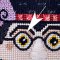 Wired Braid used for glasses on this Robin King needlepoint